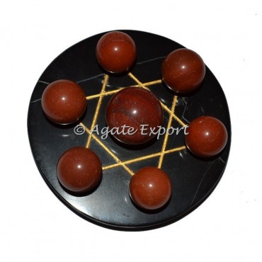 7 Red JAsper Ball on  Gold Star of David Black Base