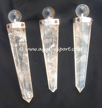 Crystal Quartz Obelisk With Garnet Stones.