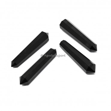 Punta biterminada de obsidiana negra
